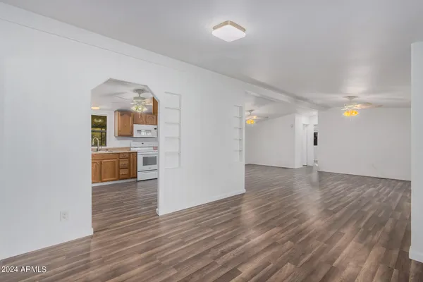 a view of a kitchen with a sink and a refrigerator