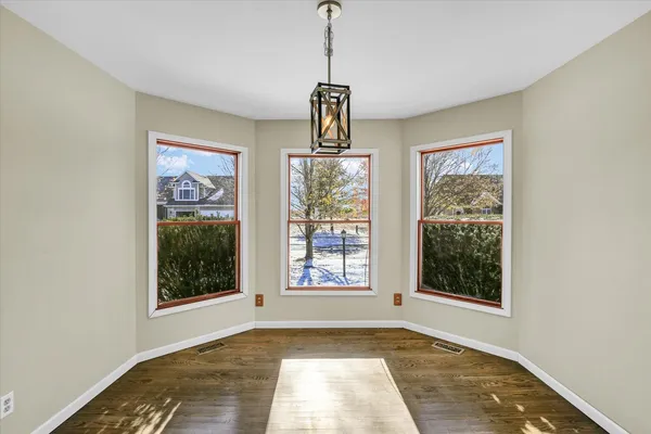a view of an empty room with windows