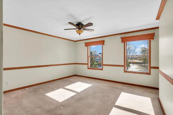 a view of empty room with windows