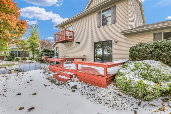 a view of a backyard with a sitting area