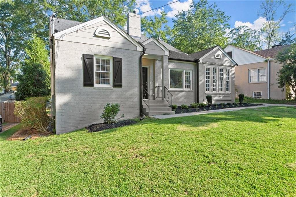 228 Derrydown Way Decatur, GA 30030 - Photo 1 of 1 a front view of a house with a yard