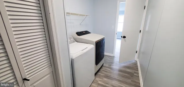 a view of a hallway with washer and dryer