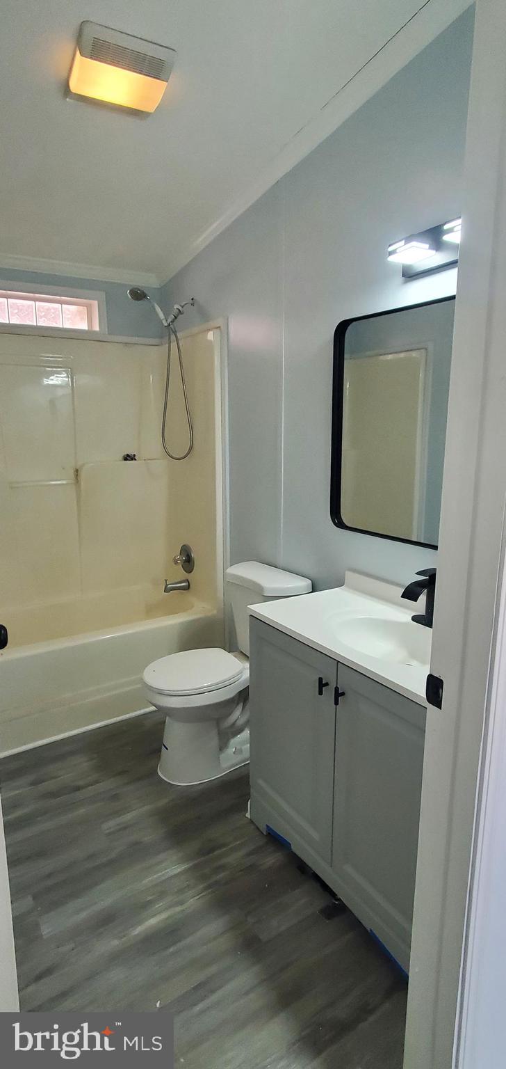1903 Bennett Road Aberdeen, MD 21001 - Photo 5 of 8 a bathroom with a sink a toilet and shower