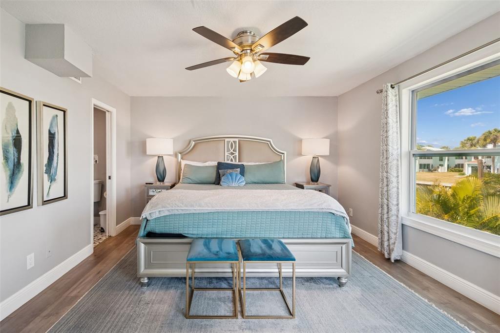 330 6th Avenue Indian Rocks Beach, FL 33785 - Photo 16 of 52 a bedroom with a bed and window