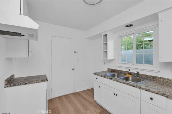 a bathroom with a sink and a window