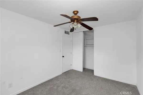 a view of a chandelier fan in a room