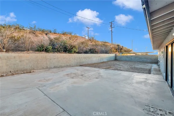 a view of a backyard of the house