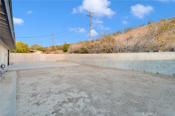 a view of a yard next to a building