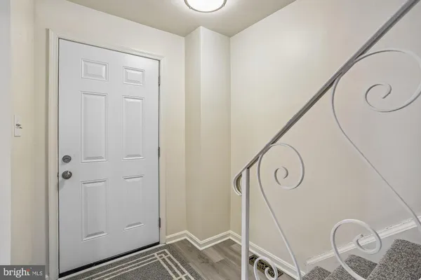 a view of an entryway with hallway