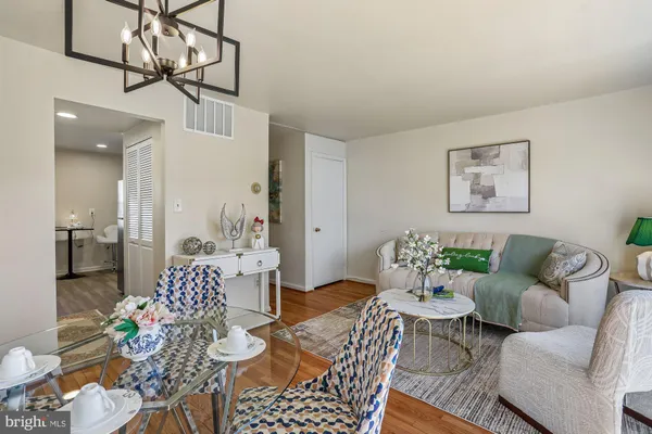 a view of a back yard of the house with a chair