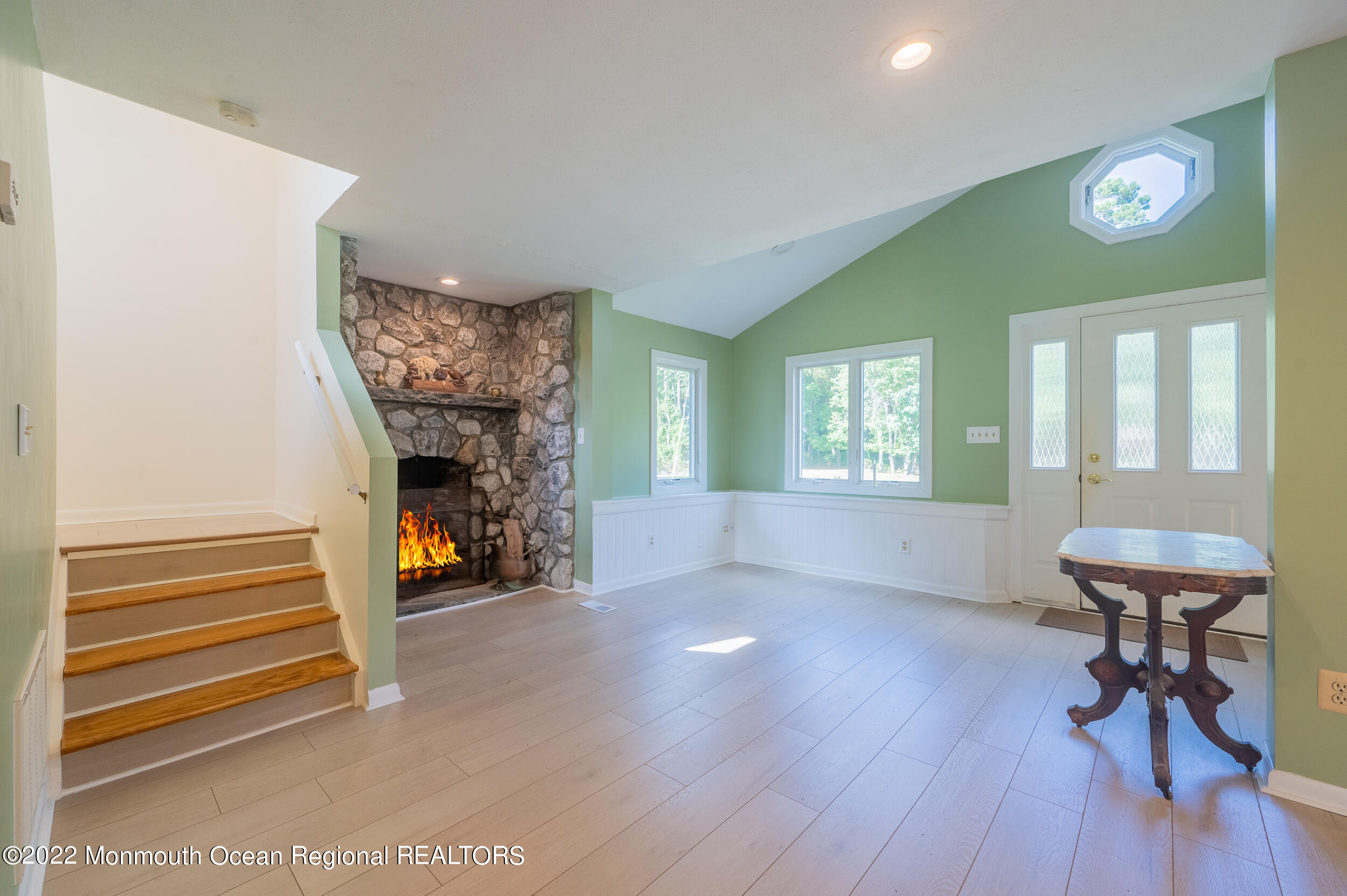 334 Georgia Road Freehold, NJ 07728 - Photo 7 of 26 a view of a livingroom with furniture and a fireplace