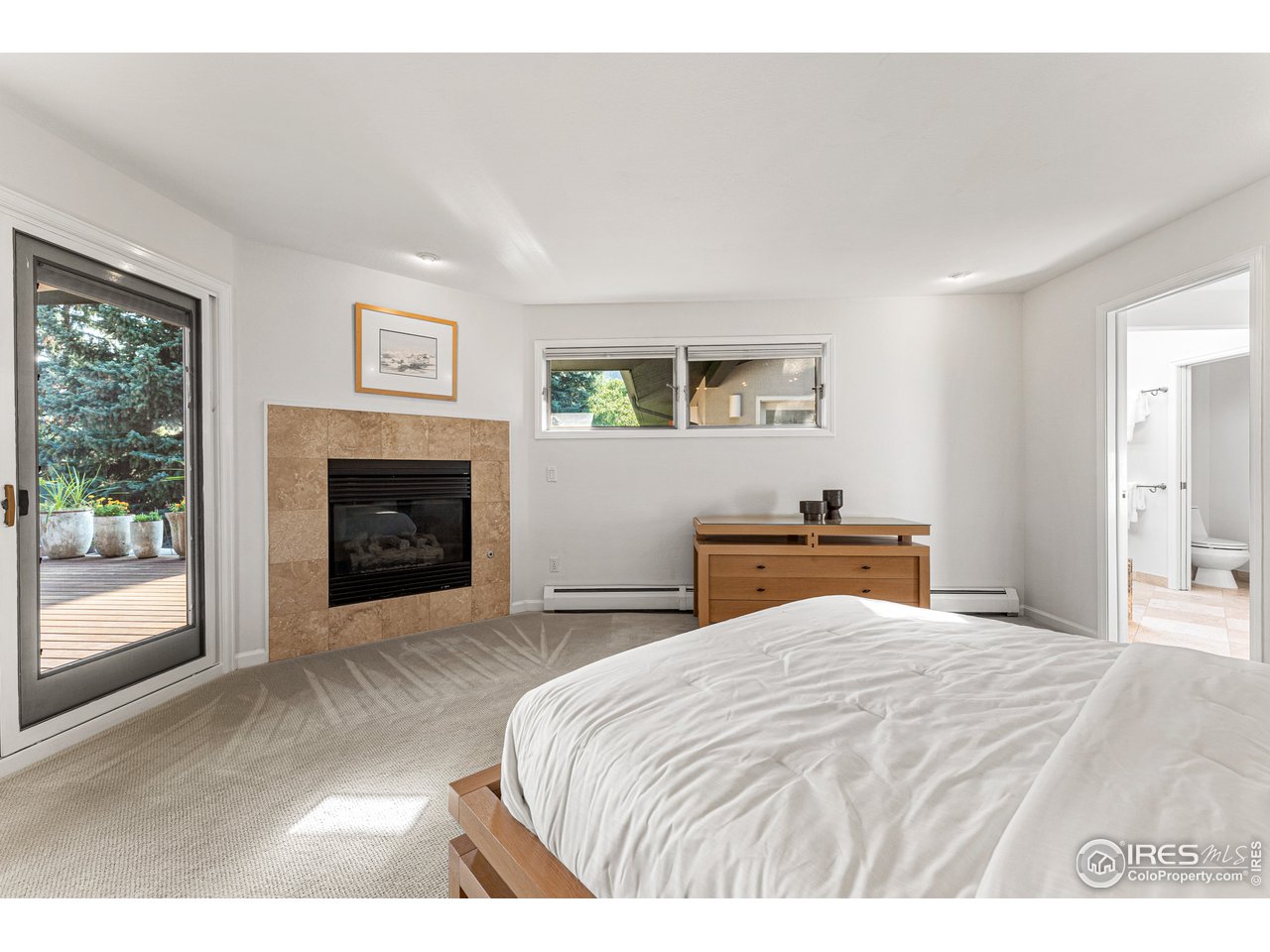 3725 Spring Valley Road Boulder, CO 80304 - Photo 20 of 40 Primary suite with corner gas fireplace and mountain views