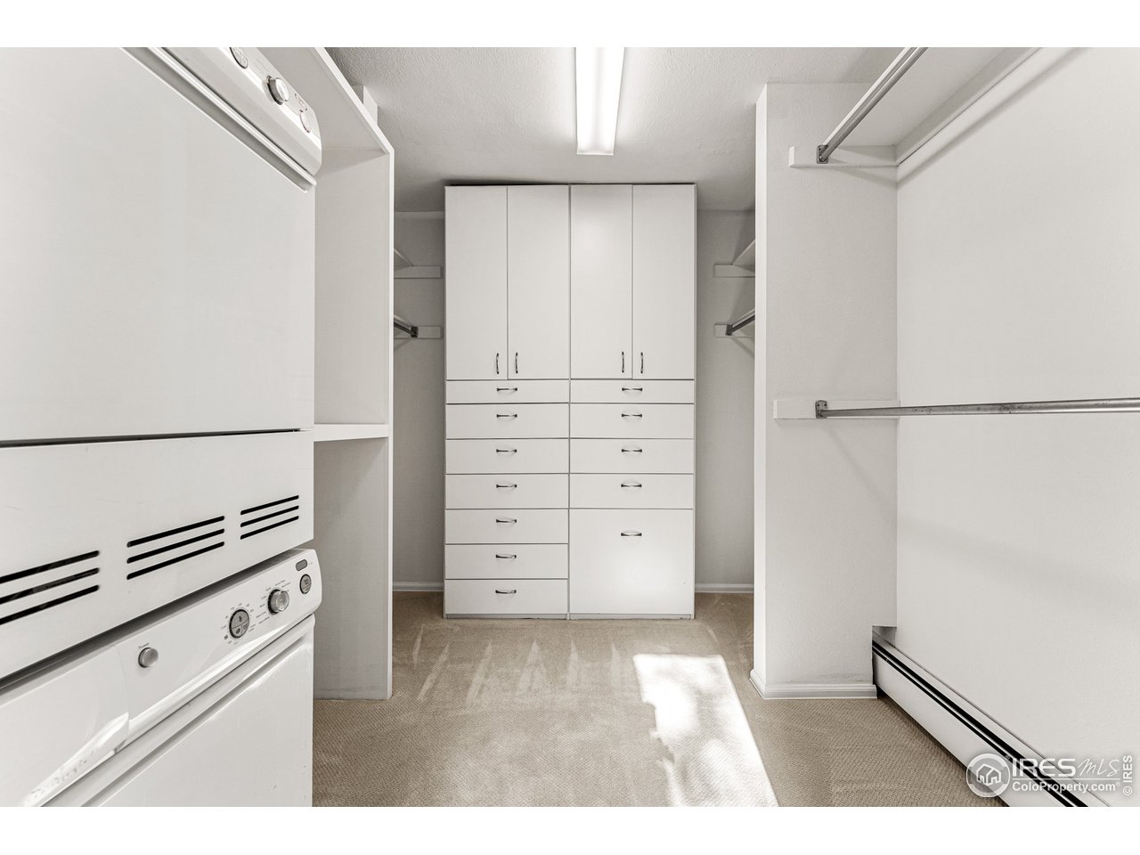 3725 Spring Valley Road Boulder, CO 80304 - Photo 24 of 40 Primary Suite walk-in closet with built-in drawers. Includes an additonal Asko washer/dryer (main washer and dryer located on lower level)
