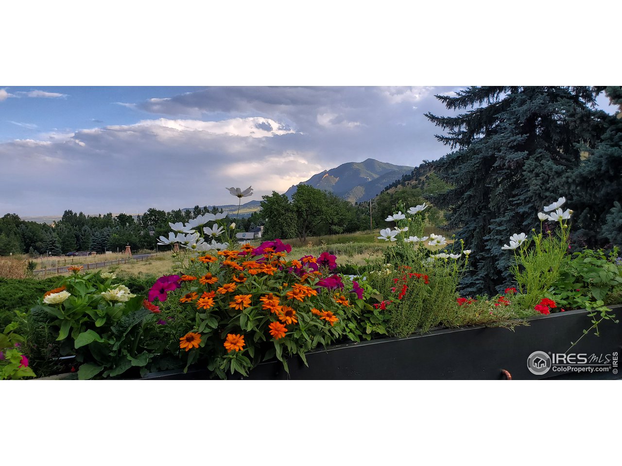 3725 Spring Valley Road Boulder, CO 80304 - Photo 4 of 40 Relax or entertain on the south facing deck, looking across open space to the unobstructed Flatiron Views