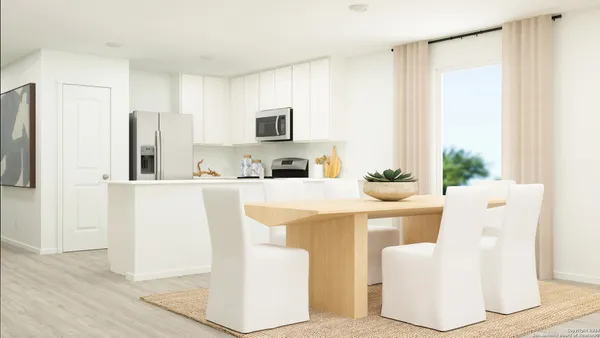 a living room with kitchen island furniture and a window