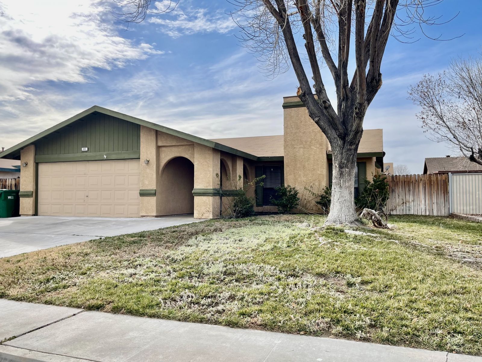 225 Michele Street Ridgecrest, CA 93555 - Photo 2 of 36 a front view of a house with a yard