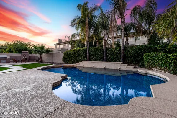 a view of a swimming pool with a patio