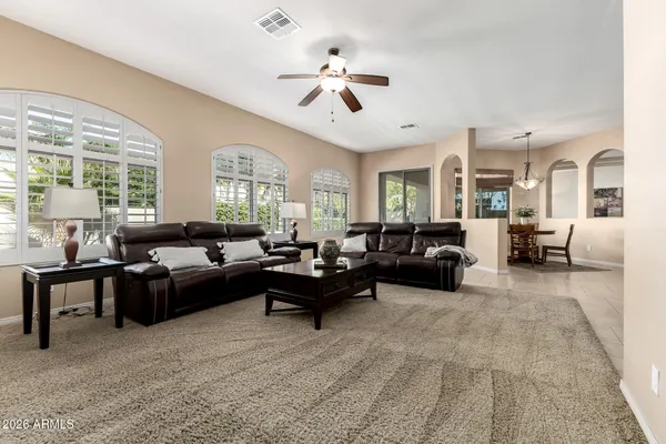 a living room with furniture or couches and a large window