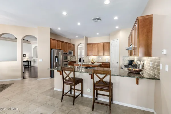 a view of a kitchen and dining room