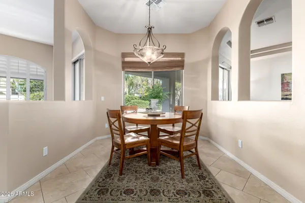 a view of a dining room with furniture window and outside view