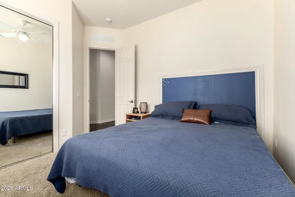 a bedroom with furniture and a window