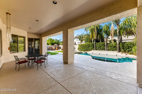 a view of a swimming pool with a patio