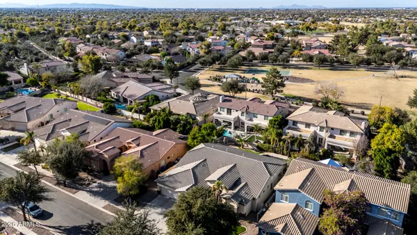 an aerial view of residential houses and outdoor space