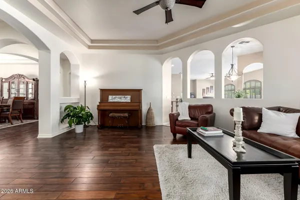 a living room with furniture and wooden floor