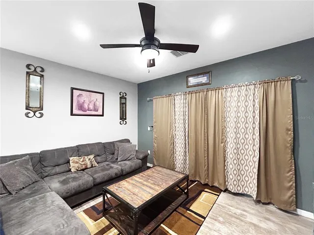 a living room with furniture and a window