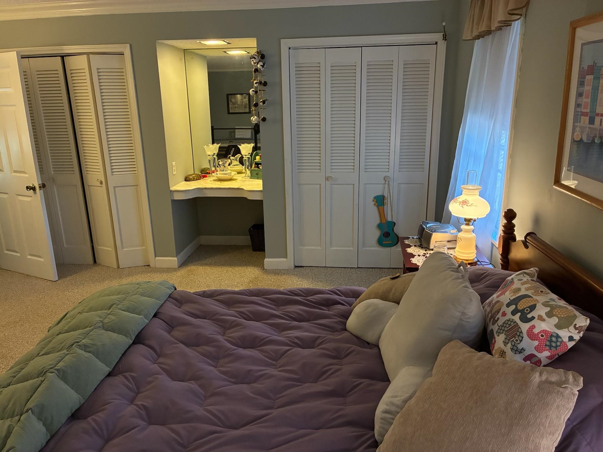 3194 Lammermuir Road Memphis, TN 38128 - Photo 26 of 40 Built-in vanity with integrated mirror, flanked by dual bi-fold louvered closet doors
