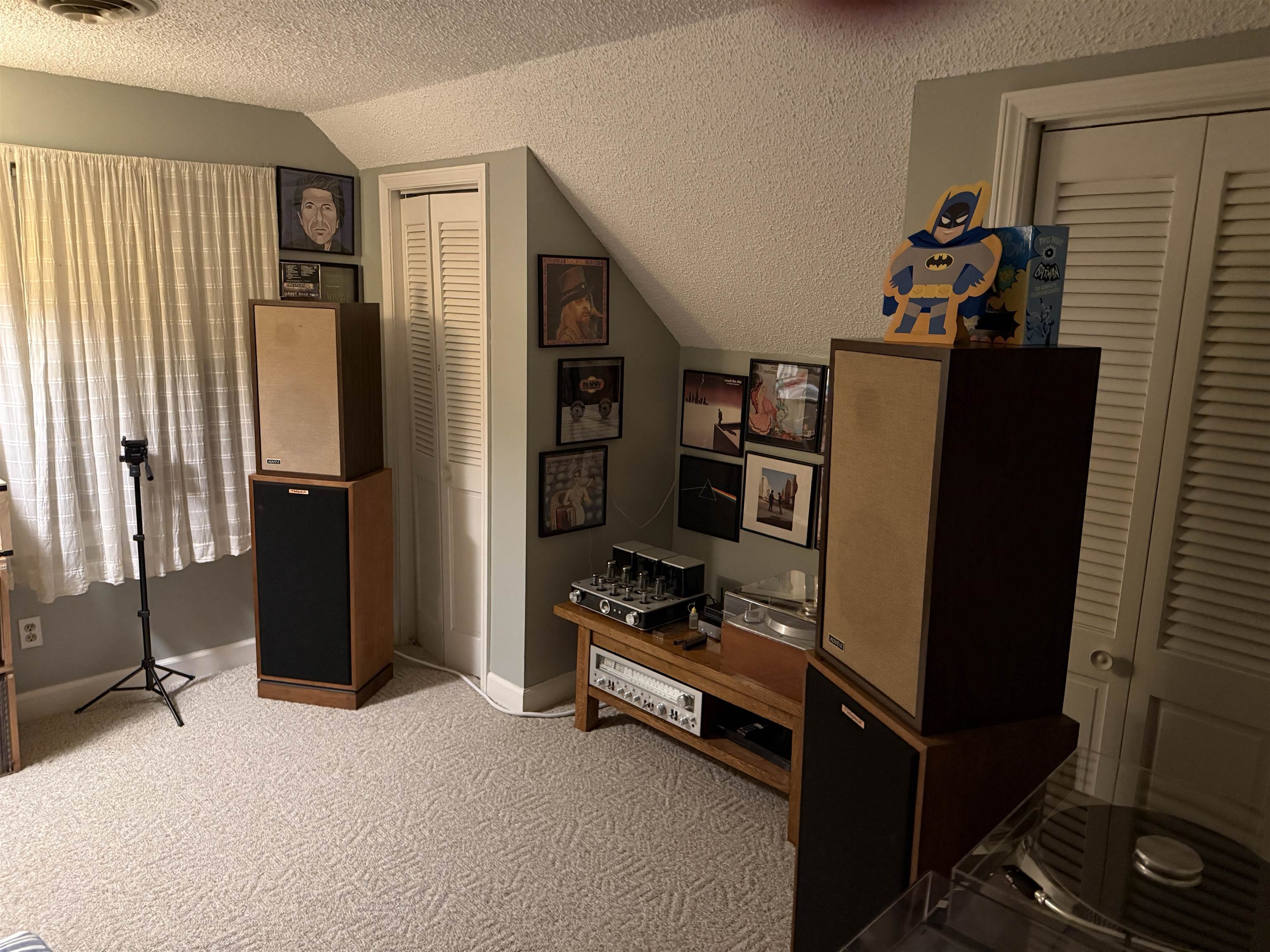 3194 Lammermuir Road Memphis, TN 38128 - Photo 29 of 37 Carpeted interior space featuring a window with white curtains, a textured ceiling, a louvered bi-fold door, and an angled wall