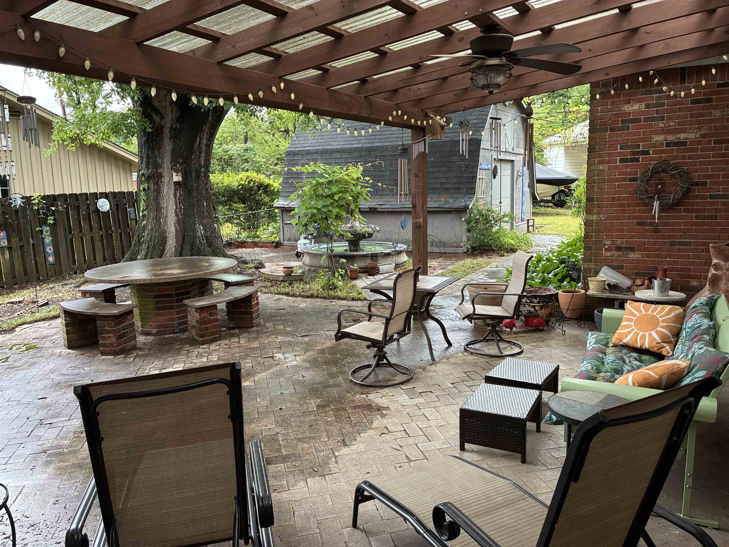 3194 Lammermuir Road Memphis, TN 38128 - Photo 37 of 40 Expansive brick patio with a wood pergola featuring a ceiling fan