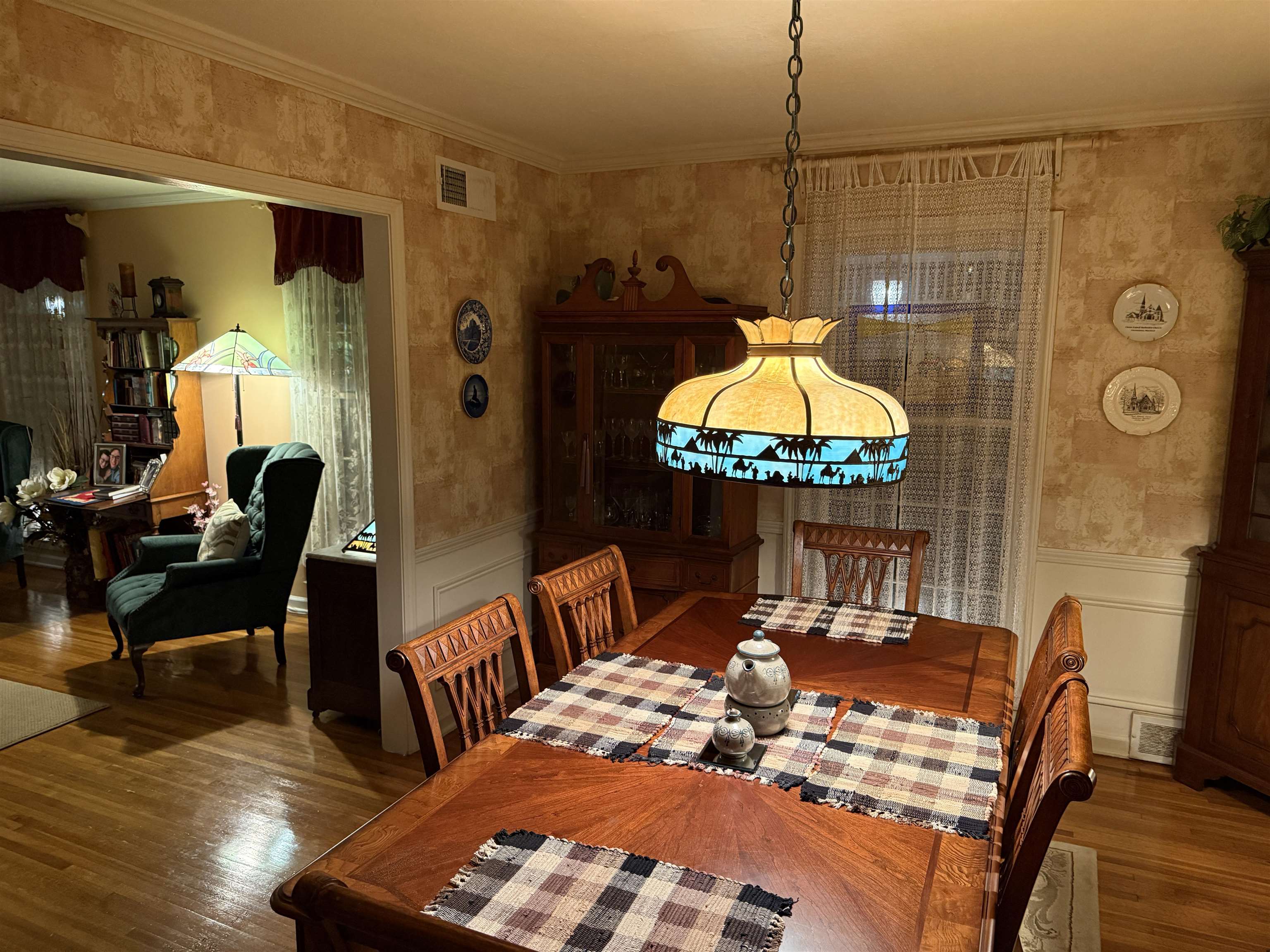 3194 Lammermuir Road Memphis, TN 38128 - Photo 6 of 37 Formal dining area featuring wood-finish flooring, a decorative ceiling fixture, and a large window with sheer window coverings