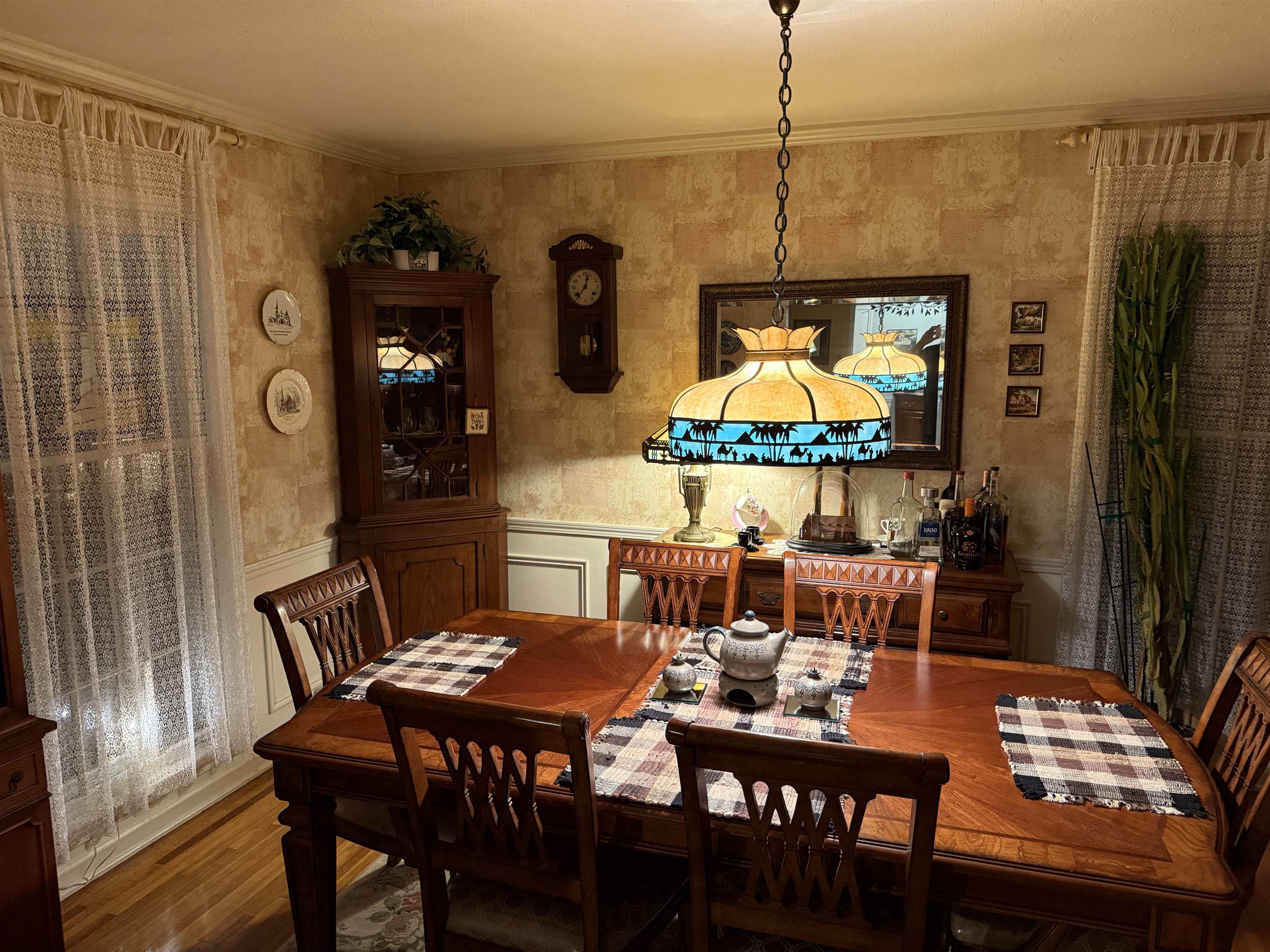3194 Lammermuir Road Memphis, TN 38128 - Photo 7 of 37 Dining area featuring wood-finish flooring, a decorative corner cabinet, and a chandelier with a patterned shade