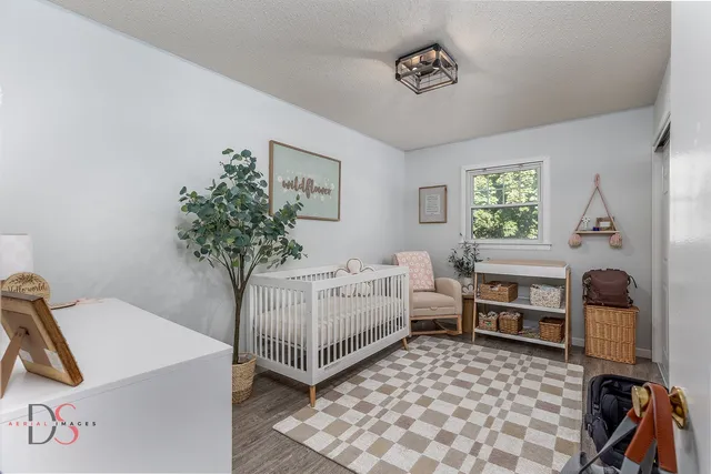 a bedroom with furniture and a window