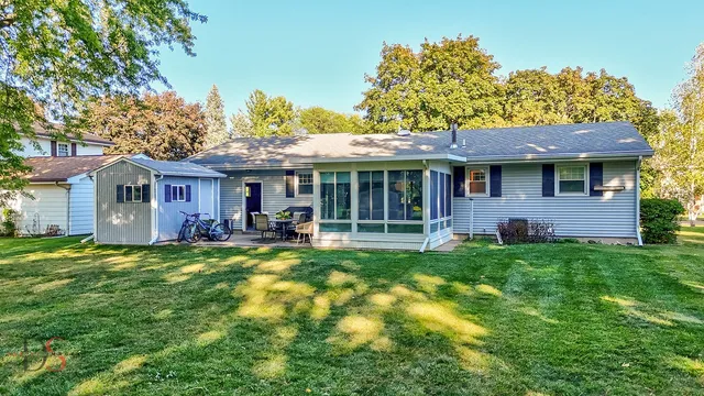 a view of a house with a backyard