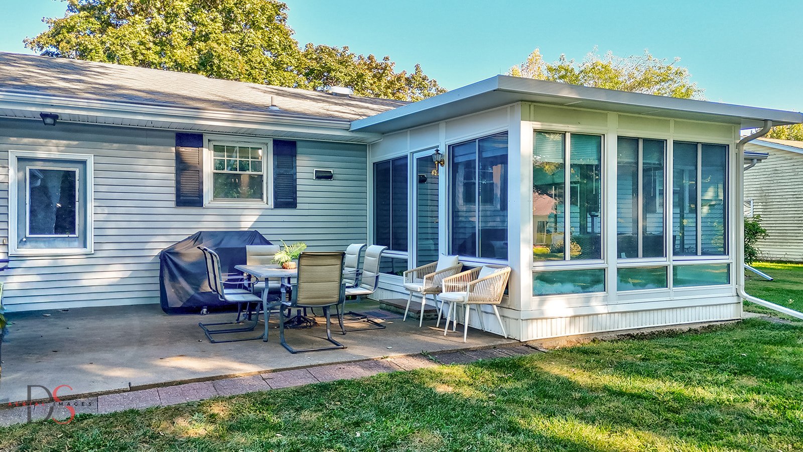2106 Cedar Avenue Mendota, IL 61342 - Photo 6 of 24 a view of a house with a patio and a yard