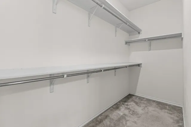 a view of an empty walk in closet