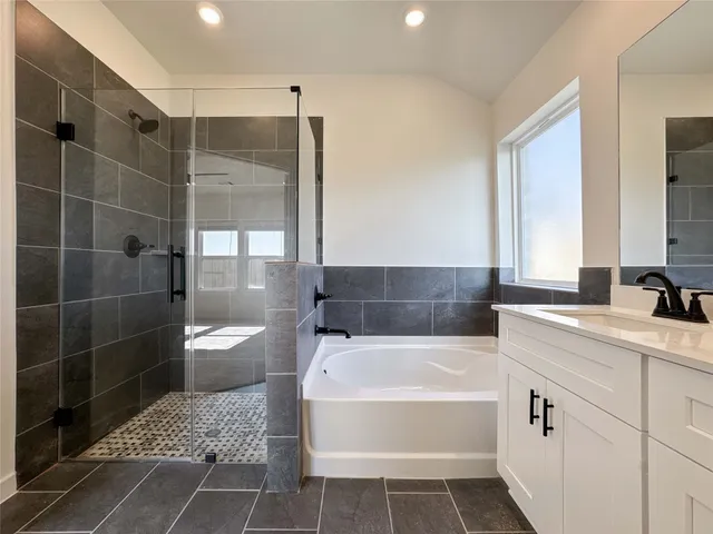 a bathroom with a bathtub sink and toilet