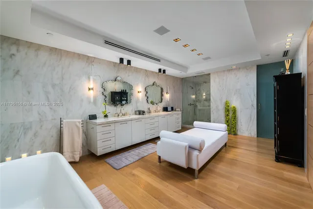 a white bath tub sitting in a bathroom