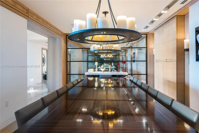 a living room with a table and chairs