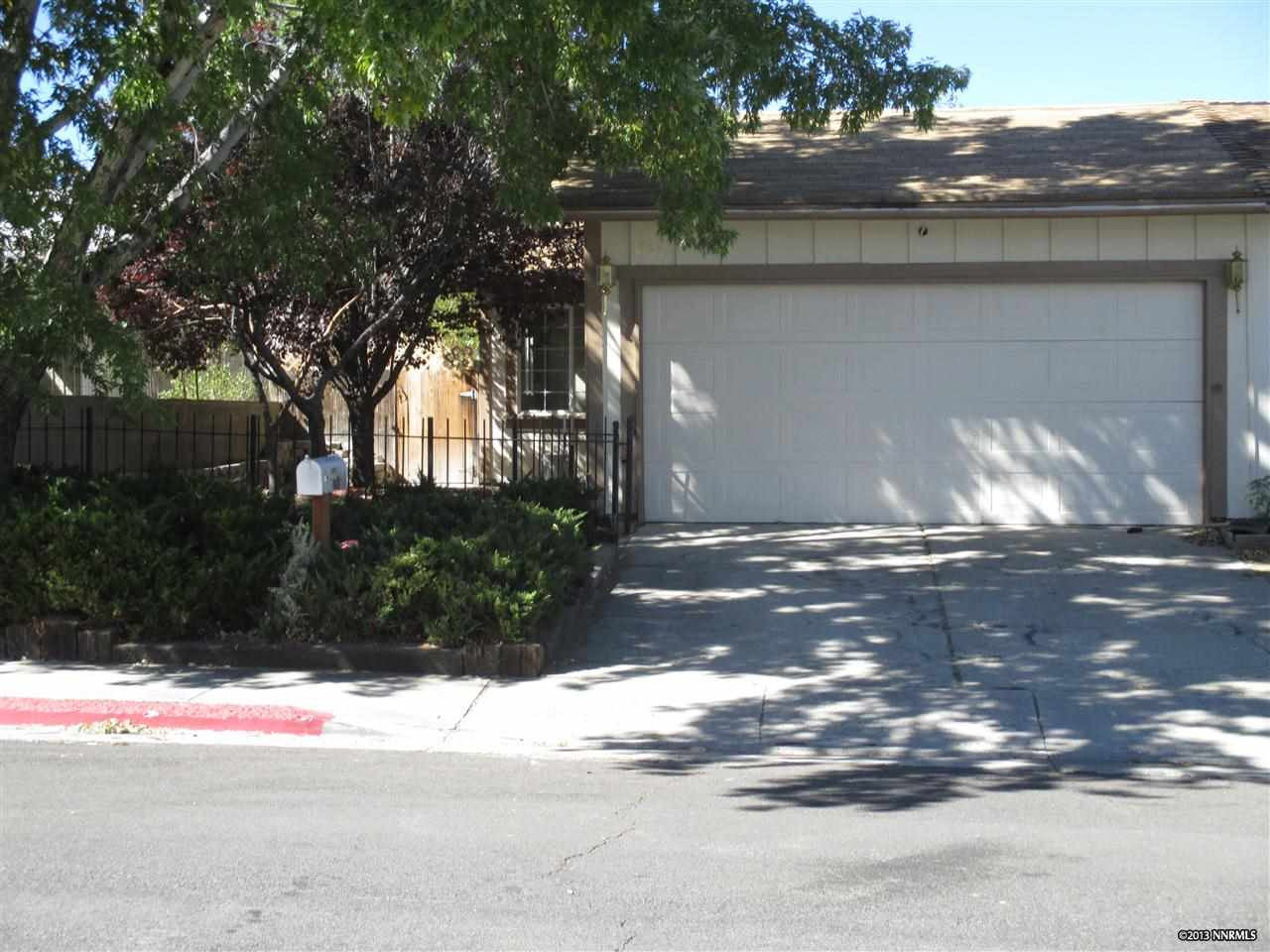 6571 Flower Street Reno, NV 89506 - Photo 1 of 1 a view of street along with trees