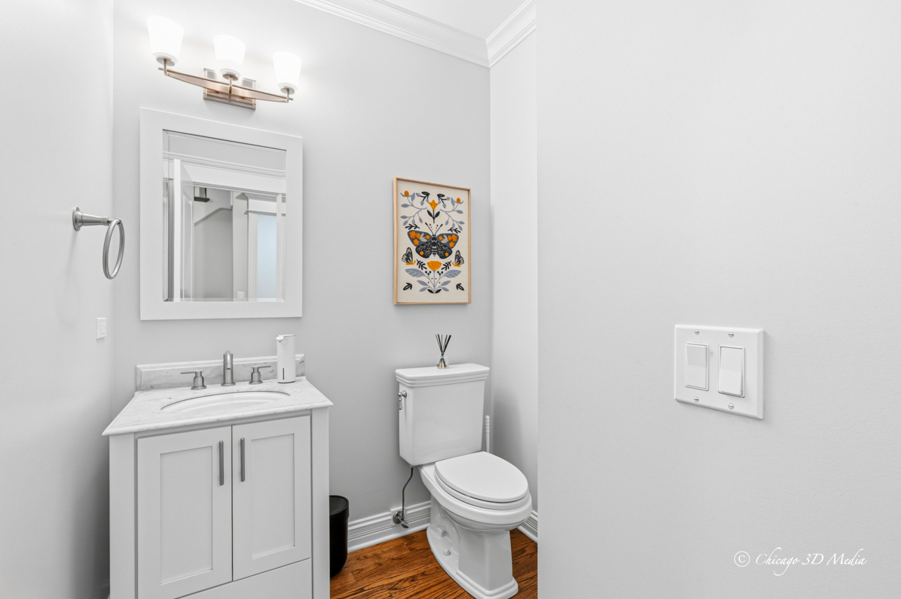 306 17th Street Wilmette, IL 60091 - Photo 44 of 48 a bathroom with a toilet sink vanity and mirror