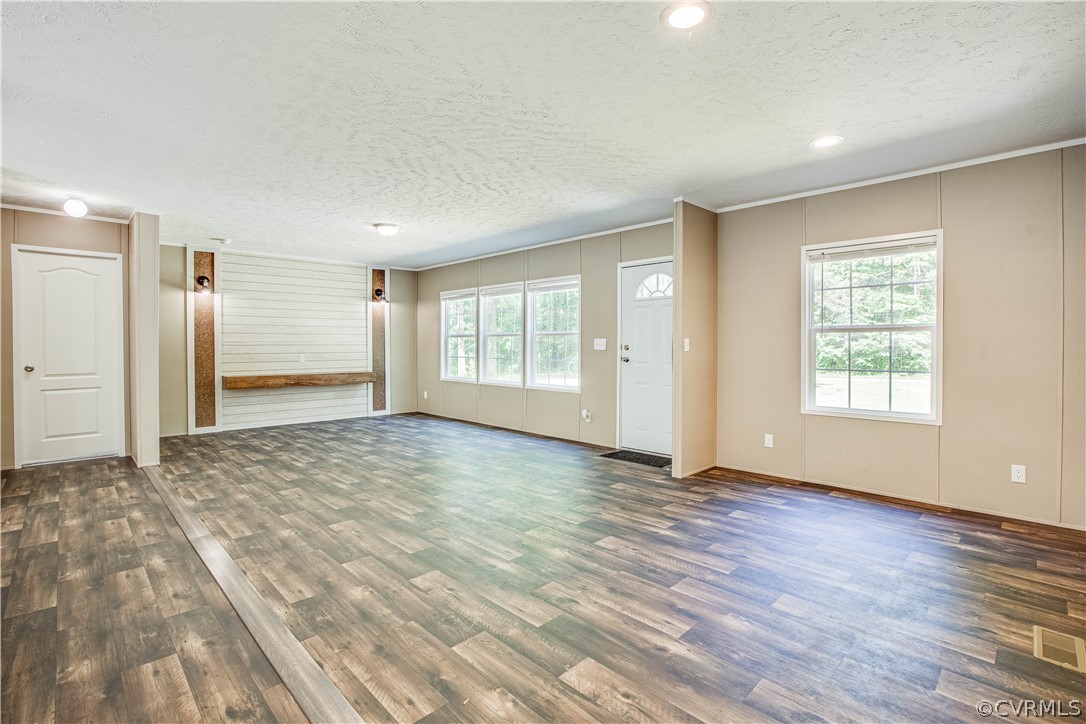 411 Goodwin Store Road Louisa, VA 23093 - Photo 14 of 38 an empty room with wooden floor and windows