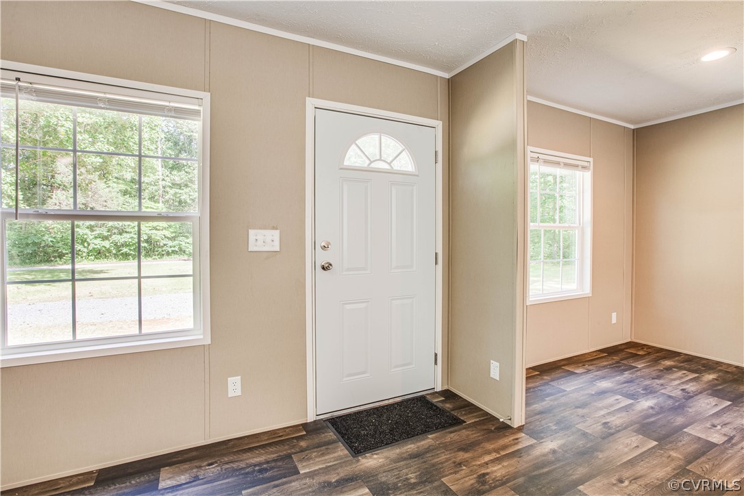 411 Goodwin Store Road Louisa, VA 23093 - Photo 16 of 38 a view of an empty room with wooden floor and a window