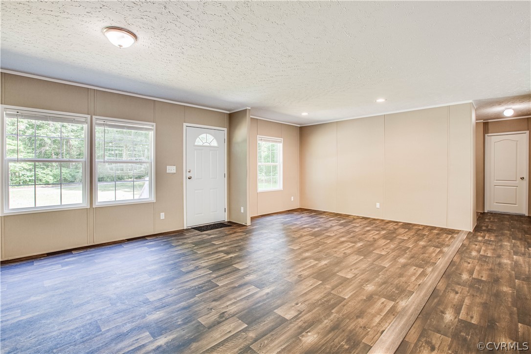 411 Goodwin Store Road Louisa, VA 23093 - Photo 18 of 38 an empty room with wooden floor and windows