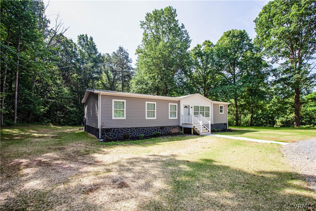 411 Goodwin Store Road Louisa, VA 23093 - Photo 2 of 38 a front view of a house with a yard