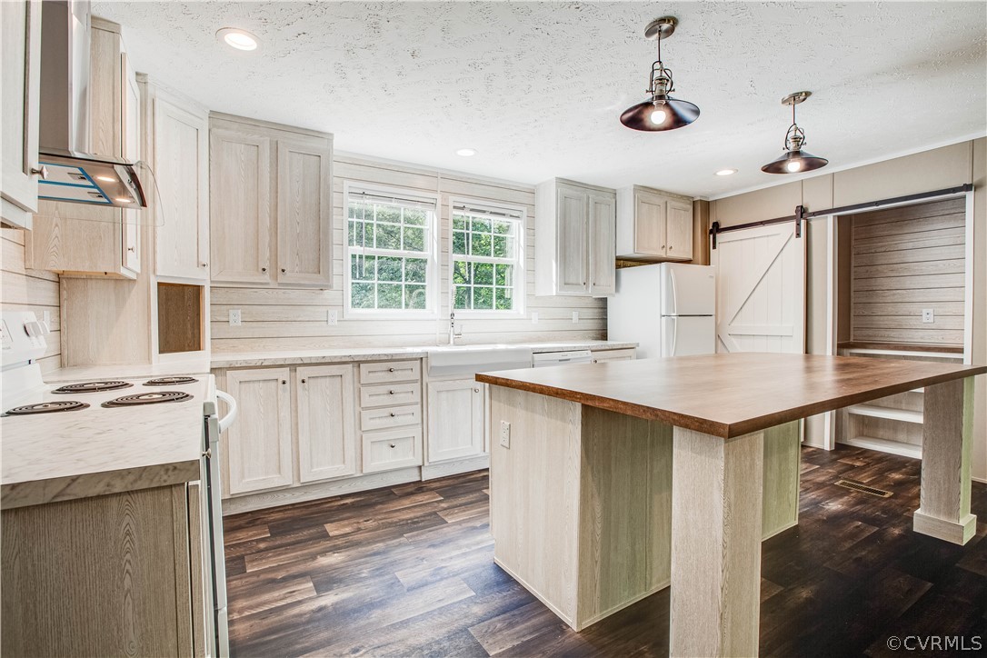 411 Goodwin Store Road Louisa, VA 23093 - Photo 21 of 38 a kitchen with granite countertop a sink appliances cabinets and furniture