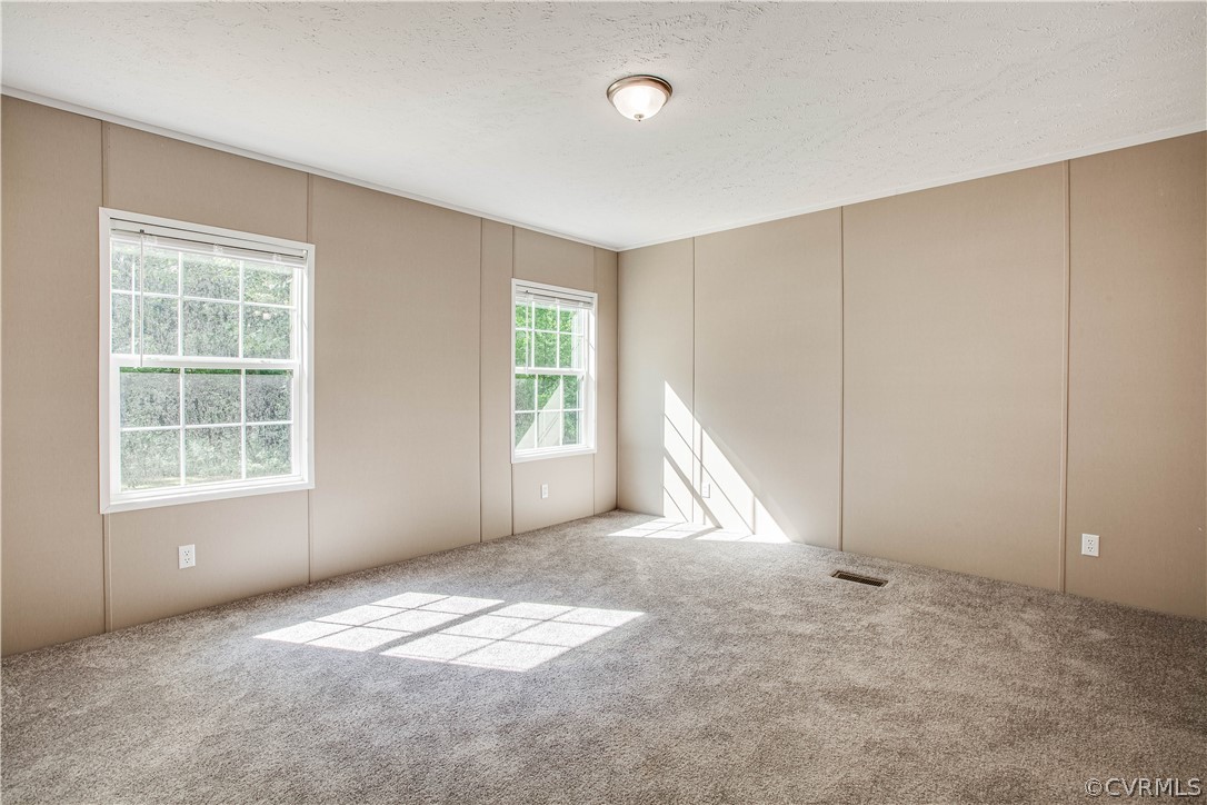 411 Goodwin Store Road Louisa, VA 23093 - Photo 3 of 38 an empty room with a window