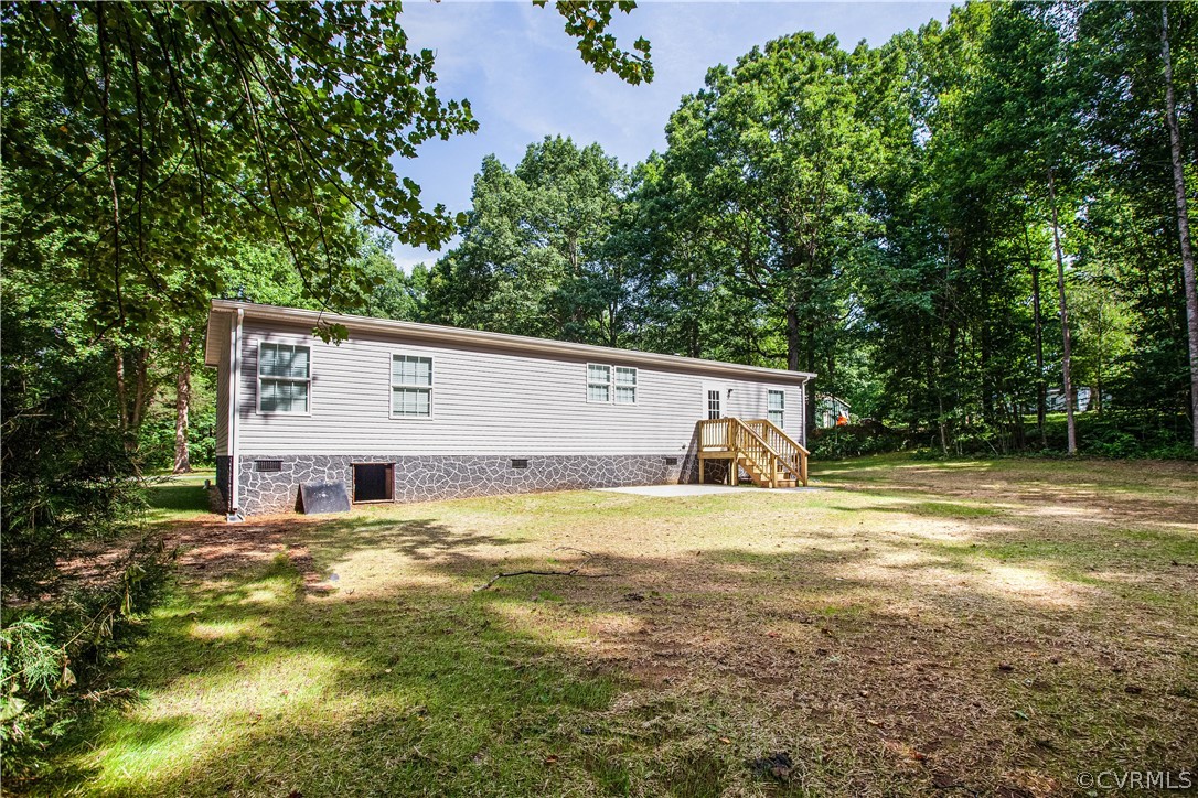 411 Goodwin Store Road Louisa, VA 23093 - Photo 31 of 38 a view of a house with pool and a big yard